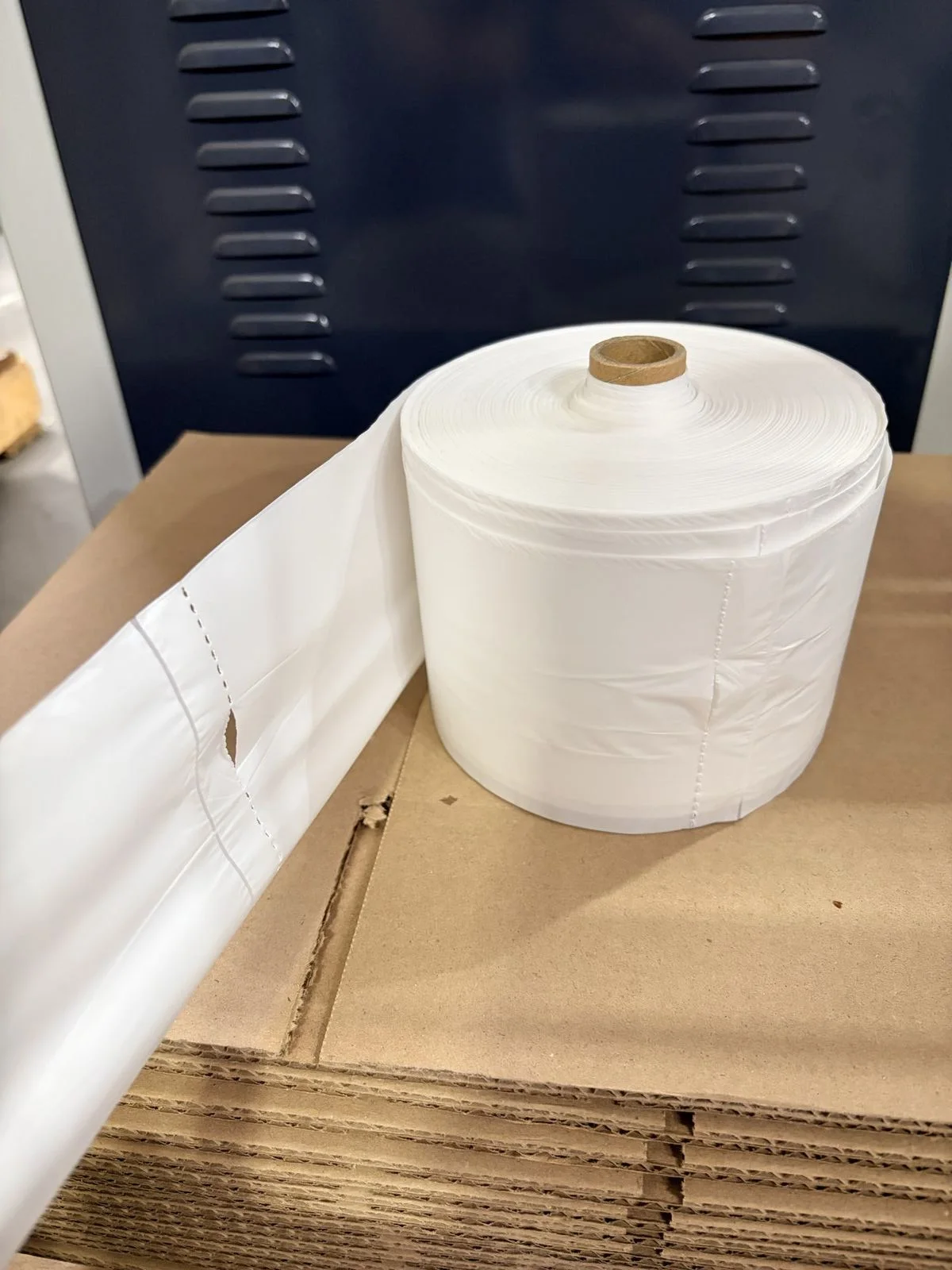 Produce bag roll on dispenser