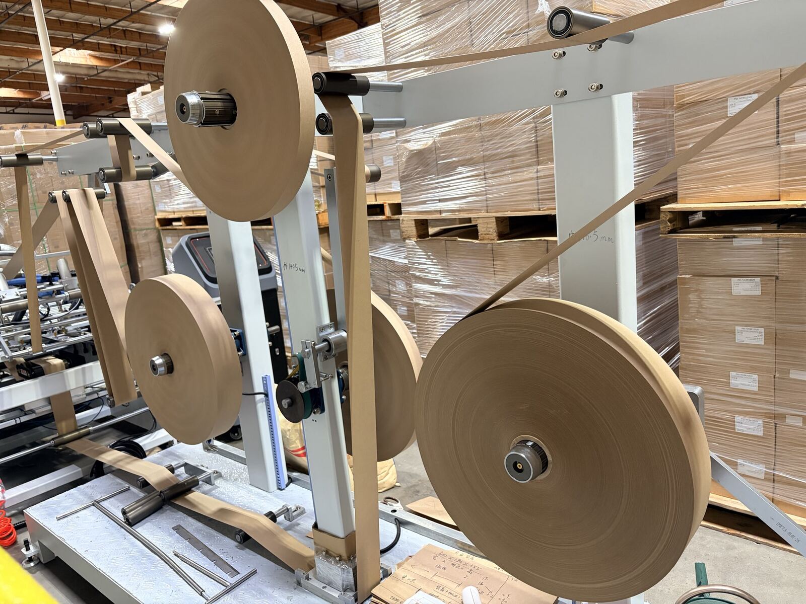 Paper feed rolls on production line